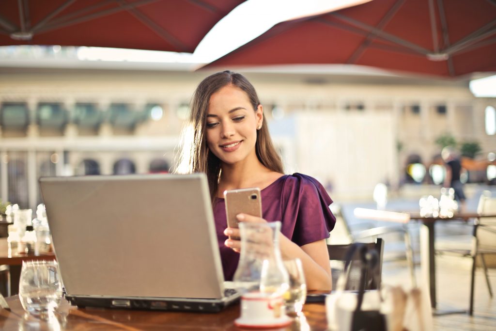 women using mobile at all smile office